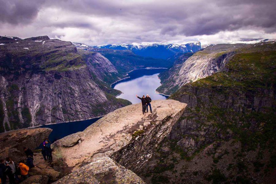 Two people standing on a rock outcrop